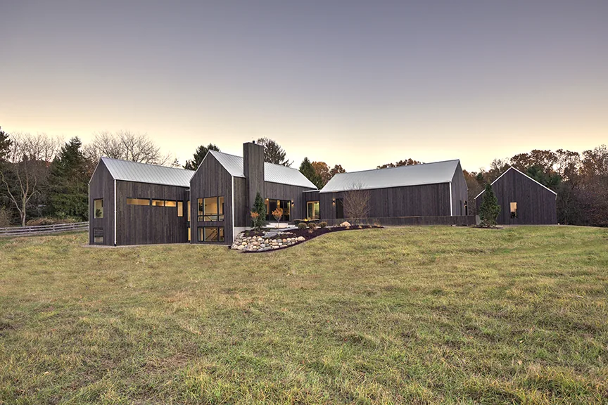 Hygge home rear elevation at dusk in Ada, MI